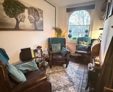Cosy counselling room at Deep Roots Counselling Service Southend-on-Sea with armchairs for therapy sessions